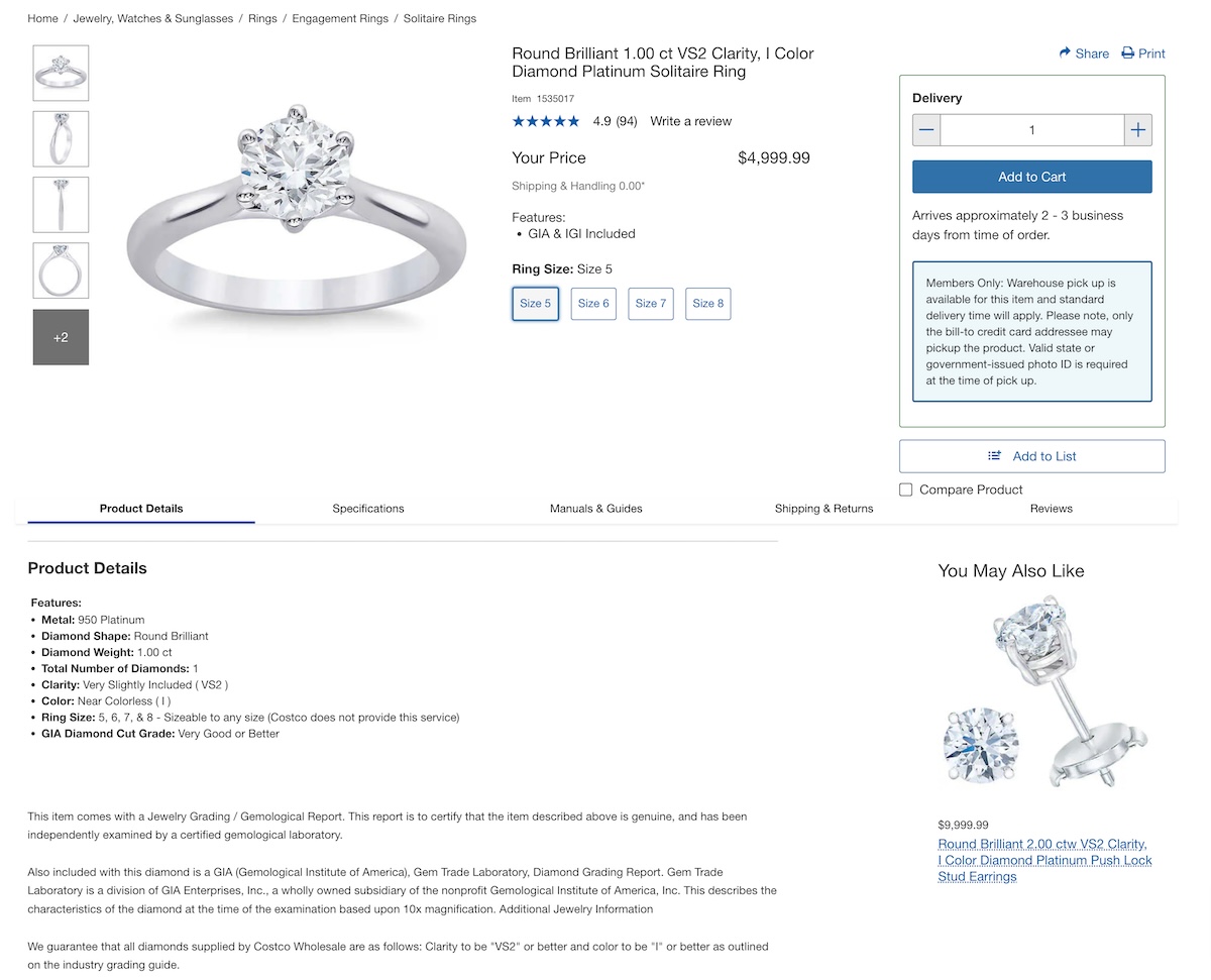 A product listing for a Round Brilliant 1.00 ct VS2 Clarity, I Color Diamond Platinum Solitaire Ring on Costco's website. The image shows a simple yet elegant solitaire ring with a round brilliant diamond set in a platinum band.